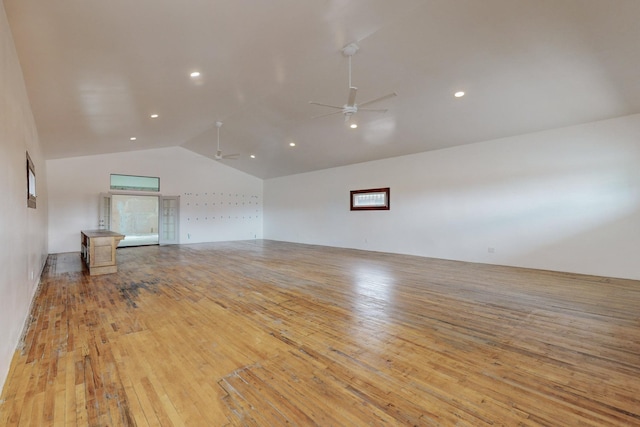 spare room with light wood-style flooring, high vaulted ceiling, a ceiling fan, and recessed lighting