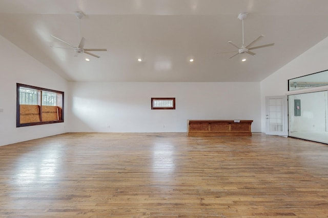 unfurnished room with high vaulted ceiling, light wood-type flooring, ceiling fan, and recessed lighting