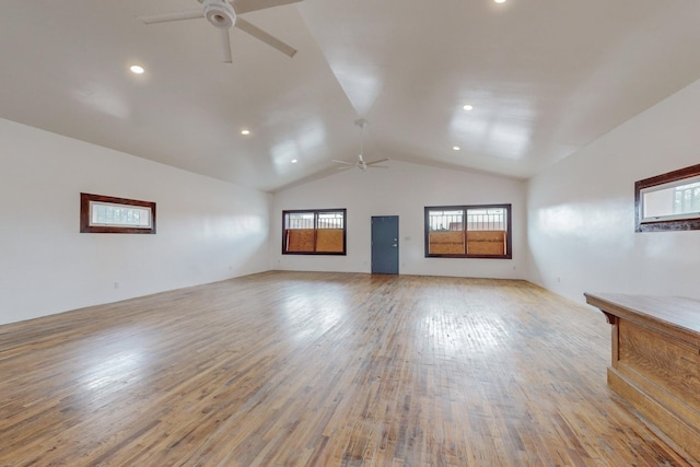 unfurnished living room featuring light wood-type flooring, ceiling fan, vaulted ceiling, and recessed lighting