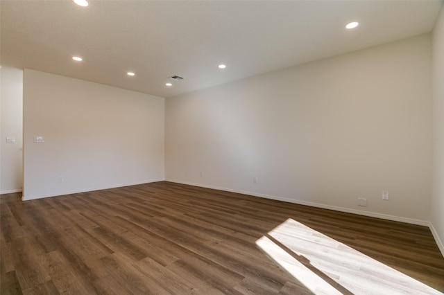 empty room featuring dark hardwood / wood-style flooring