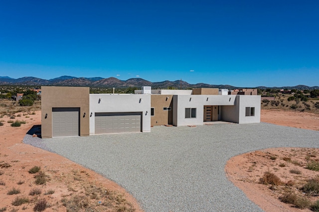 pueblo-style home with a mountain view