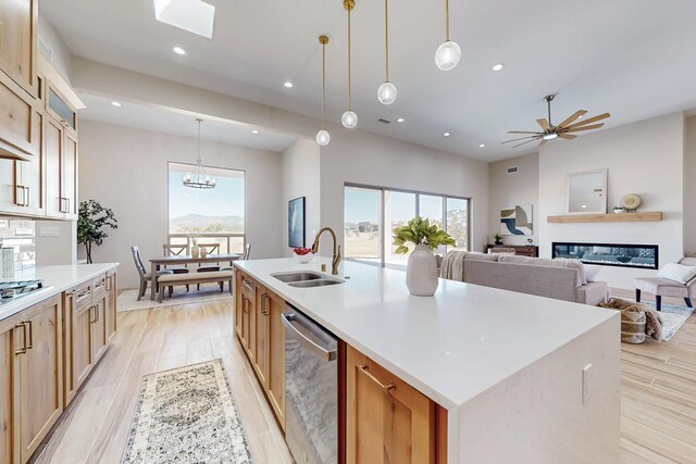 unfurnished living room with ceiling fan and light hardwood / wood-style flooring