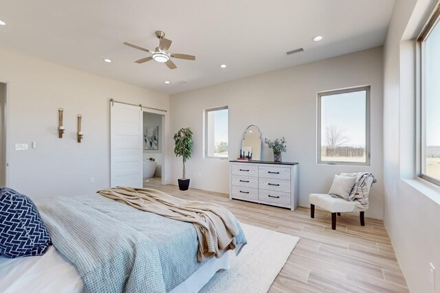 kitchen with pendant lighting, a skylight, sink, a kitchen island with sink, and dishwasher