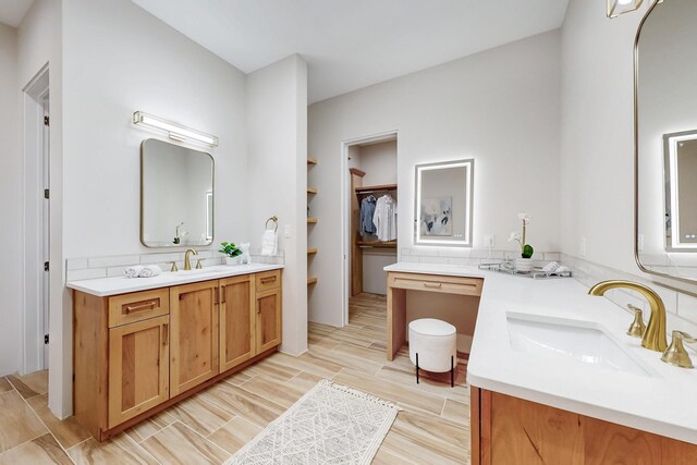 bathroom with vanity and backsplash