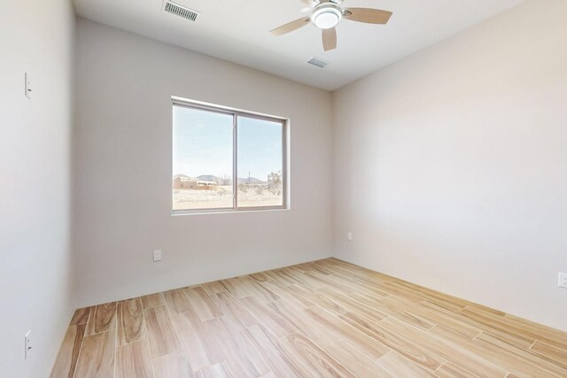 bathroom featuring hardwood / wood-style flooring and a tub to relax in