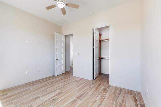 empty room featuring ceiling fan and light hardwood / wood-style floors