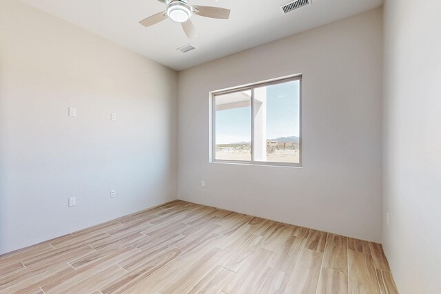 laundry area featuring gas dryer hookup, light hardwood / wood-style flooring, and hookup for an electric dryer