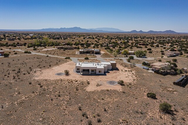 birds eye view of property with a mountain view