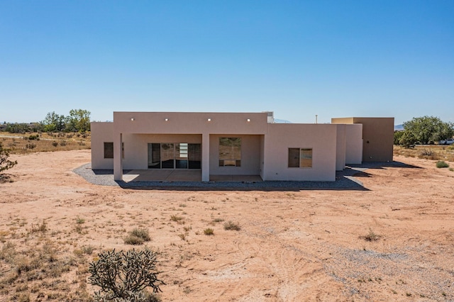 rear view of property with a patio