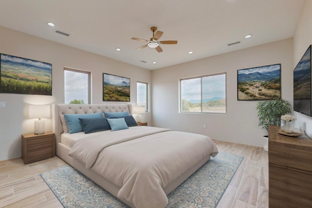 bedroom featuring ceiling fan and light wood-type flooring