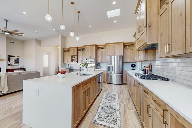 unfurnished living room with light hardwood / wood-style floors and ceiling fan