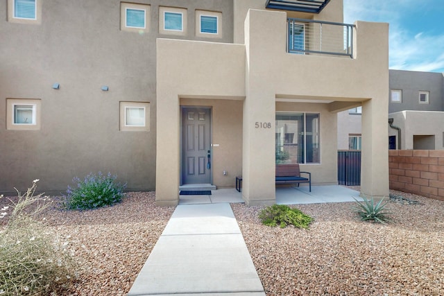 doorway to property with a patio area