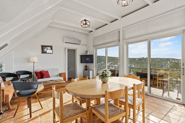 dining room with a wall mounted AC, beam ceiling, light tile patterned floors, and a textured ceiling