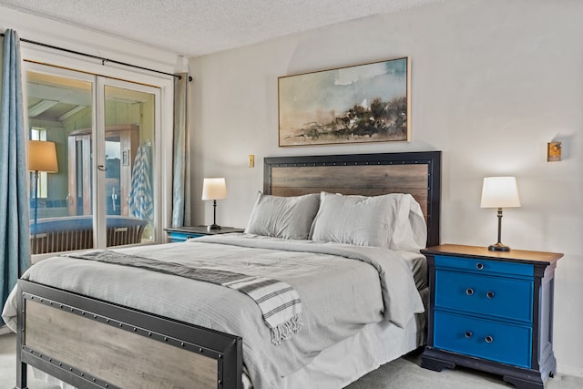 bedroom featuring carpet floors and a textured ceiling