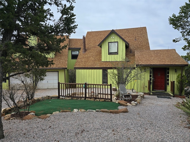 view of front facade with a garage and a front lawn