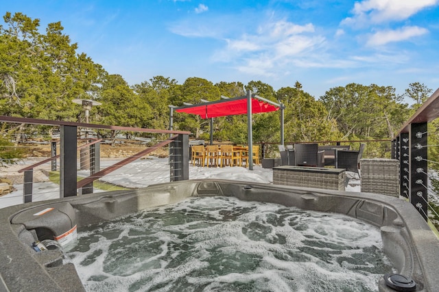 wooden deck with a patio area and a hot tub