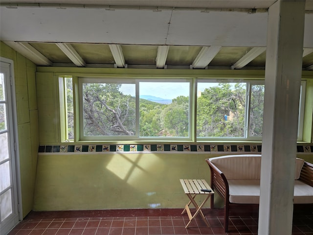 unfurnished sunroom featuring plenty of natural light