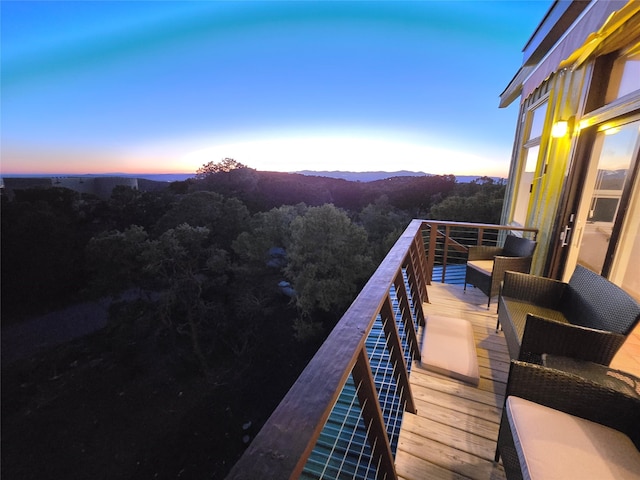 balcony at dusk featuring outdoor lounge area