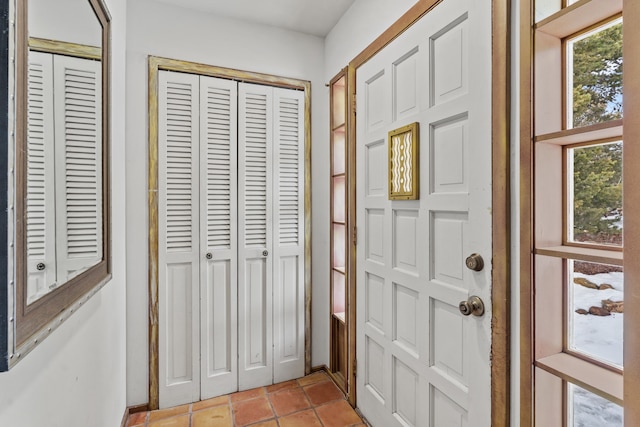 entrance foyer with light tile patterned floors