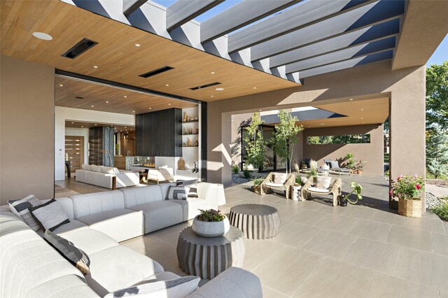 view of patio / terrace featuring an outdoor living space and a pergola