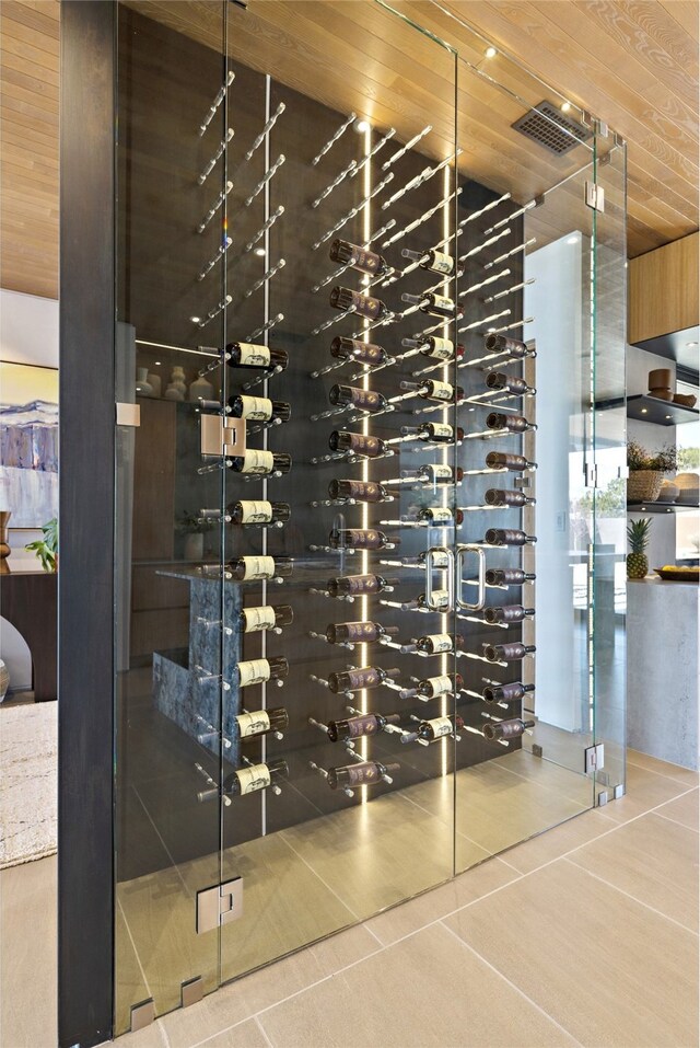 wine cellar featuring tile patterned floors and wood ceiling