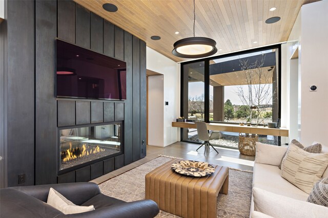 living room with wooden ceiling, expansive windows, and a multi sided fireplace