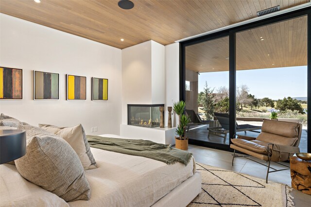 bedroom with a multi sided fireplace, floor to ceiling windows, access to exterior, and wooden ceiling