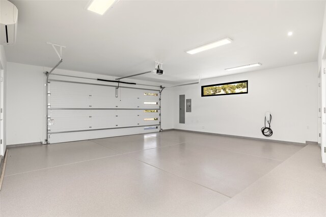 garage featuring a garage door opener and electric panel