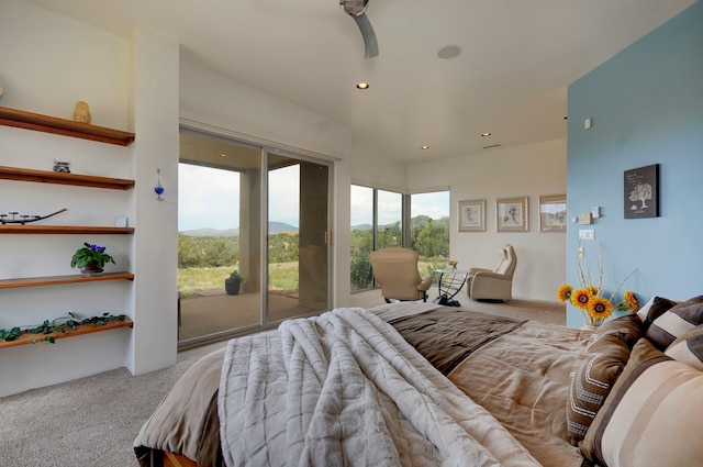 bedroom featuring light carpet and access to exterior