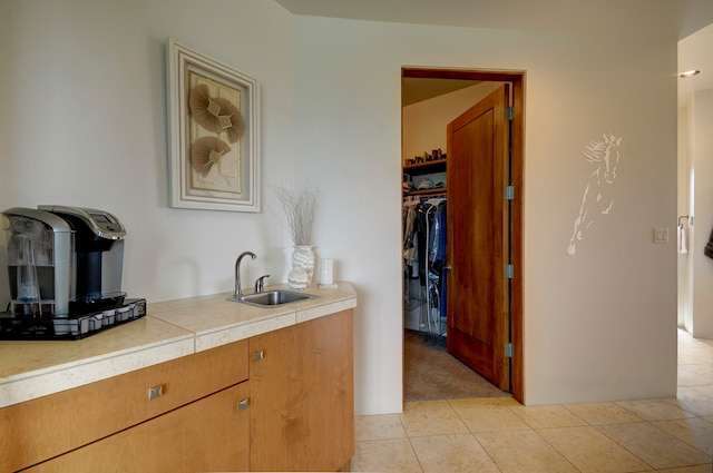 bathroom with tile patterned floors and sink