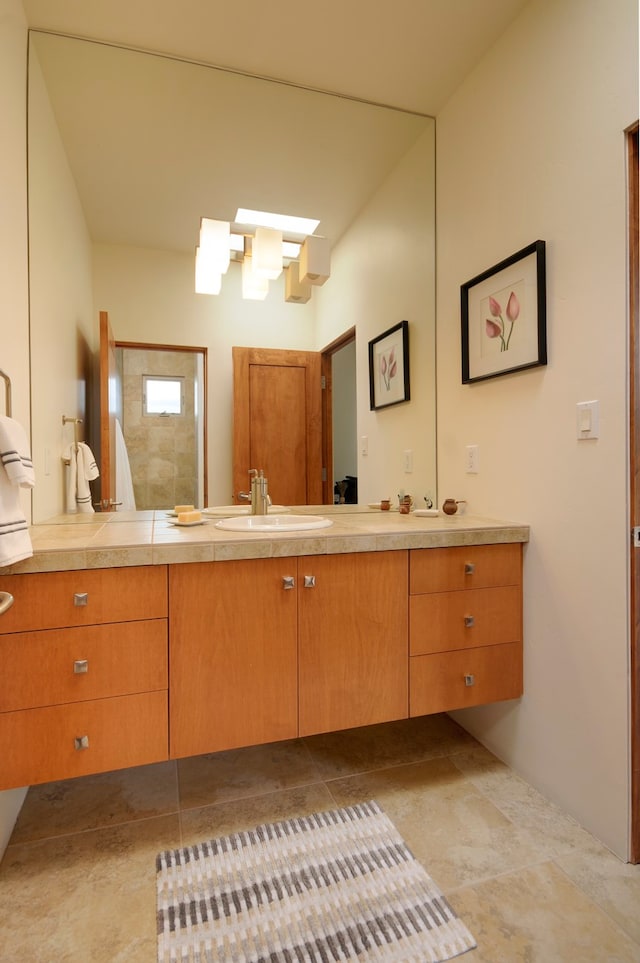 bathroom with tile patterned floors and vanity