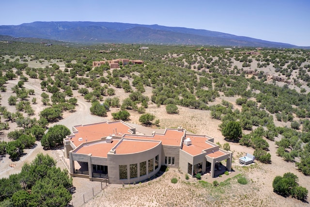 birds eye view of property featuring a mountain view