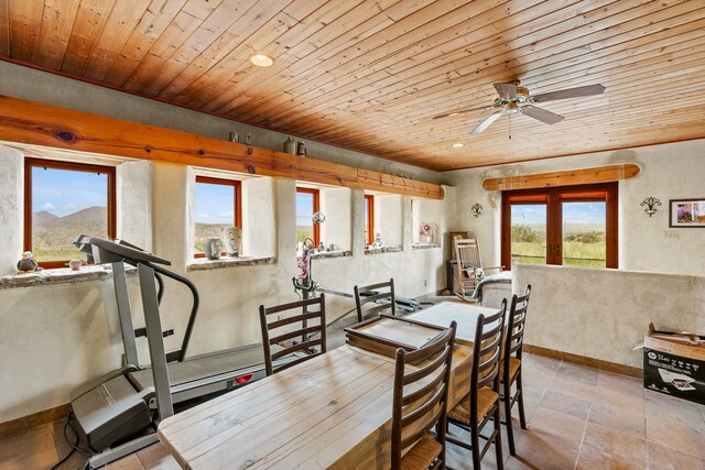 115 Waldo Mesa, Madrid, NM 87010 - tiled dining room with ceiling fan and wood ceiling