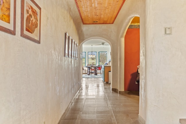 115 Waldo Mesa, Madrid, NM 87010 - hallway featuring wooden ceiling and tile patterned flooring