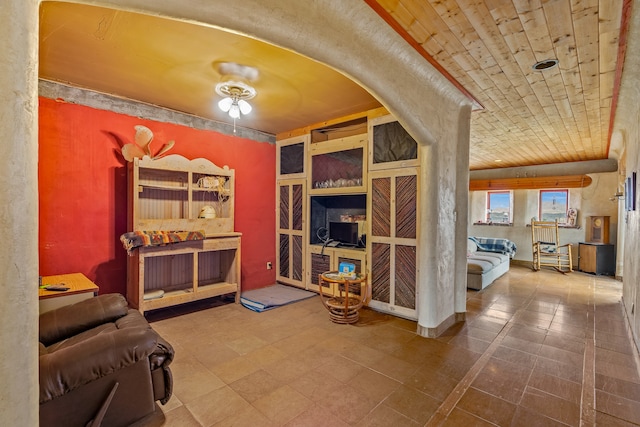 115 Waldo Mesa, Madrid, NM 87010 - tiled living room with ceiling fan