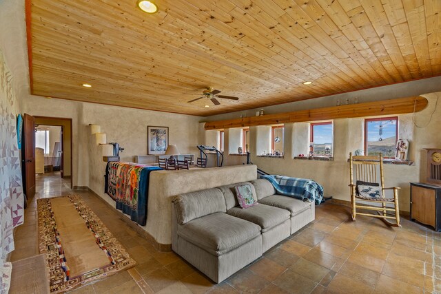 115 Waldo Mesa, Madrid, NM 87010 - tiled living room with ceiling fan and wood ceiling