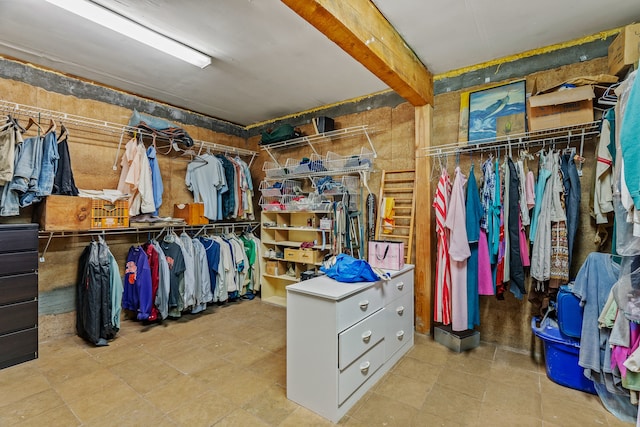 115 Waldo Mesa, Madrid, NM 87010 - spacious closet featuring beamed ceiling and tile patterned floors