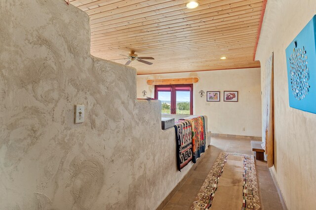 115 Waldo Mesa, Madrid, NM 87010 - hallway with tile patterned flooring and wood ceiling
