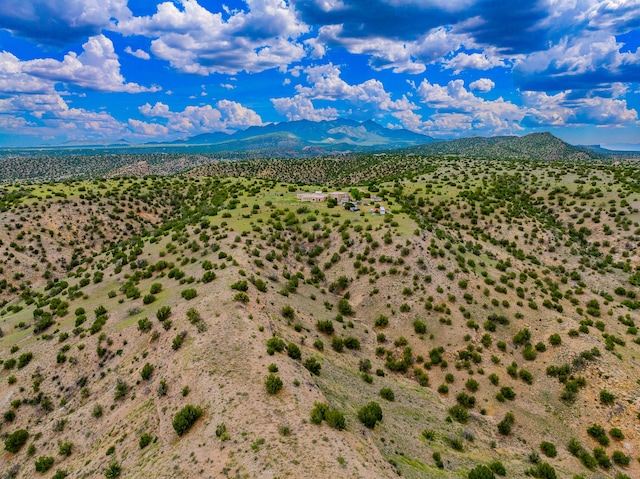 115 Waldo Mesa, Madrid, NM 87010 - drone / aerial view featuring a mountain view