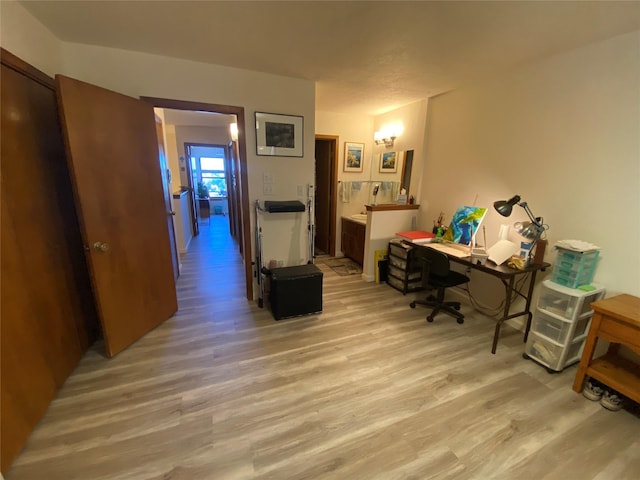 office area with light wood-style floors