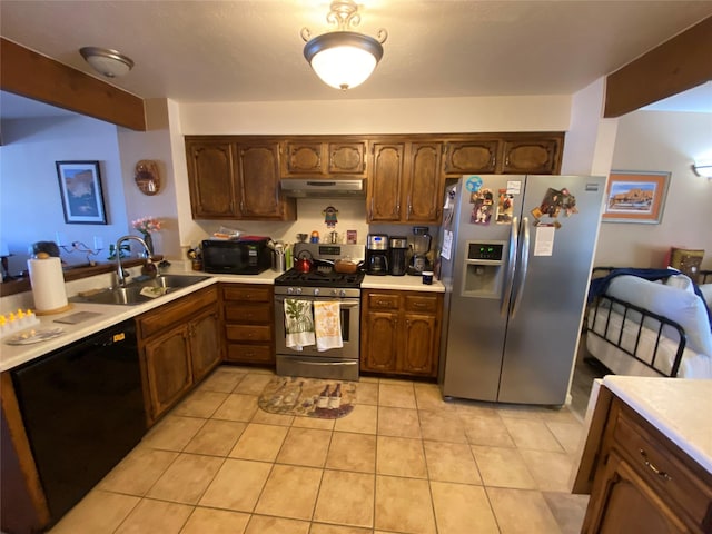 kitchen featuring beam ceiling, sink, light tile patterned floors, and black appliances