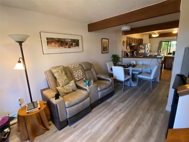 living room featuring hardwood / wood-style flooring and beamed ceiling