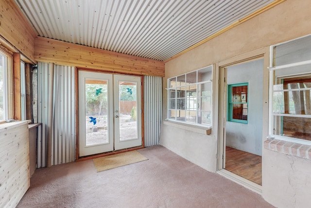 unfurnished sunroom with french doors and wooden ceiling