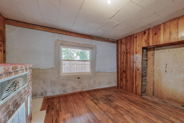 empty room with hardwood / wood-style flooring