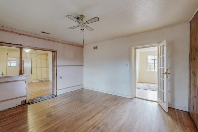 empty room featuring hardwood / wood-style flooring and ceiling fan