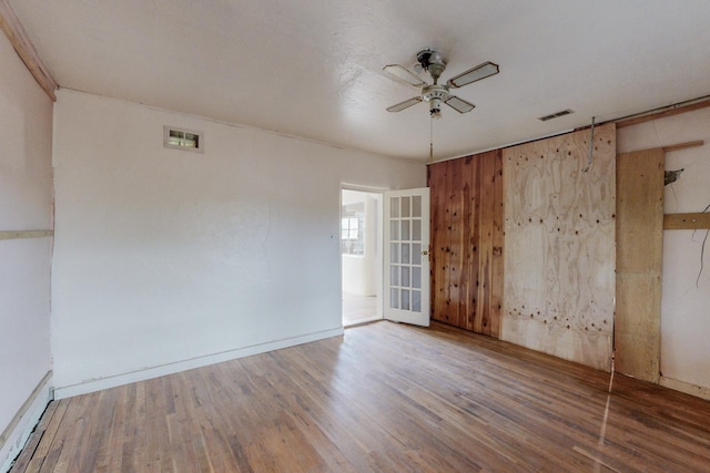 unfurnished room featuring ceiling fan and wood-type flooring