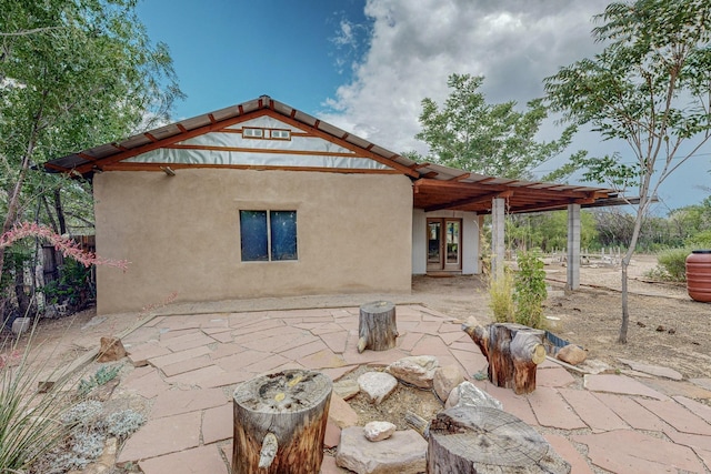 back of house with a patio