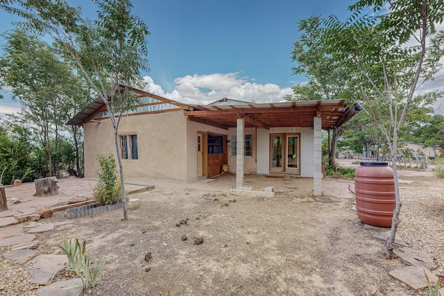 back of property featuring french doors