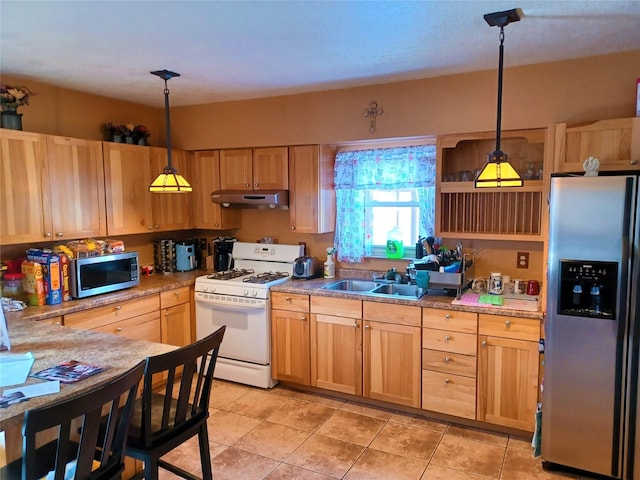 kitchen with hanging light fixtures, sink, light tile patterned floors, appliances with stainless steel finishes, and light brown cabinetry