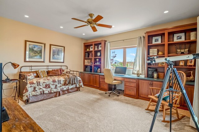 bedroom featuring ceiling fan and light carpet